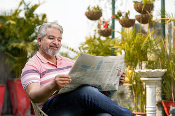 Old man reading news paper. lifestyle concept.