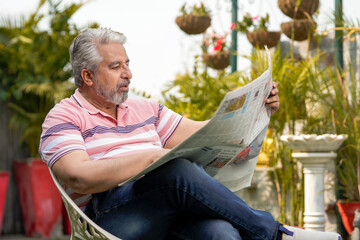 Old man reading news paper. lifestyle concept.