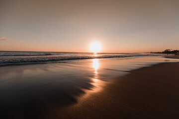 Fototapeta na wymiar Perfect sunset spot at Seminyak Beach, Bali, Indonesia