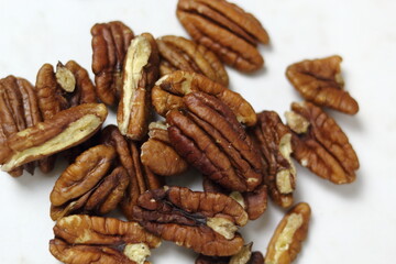 Pecan Nut Halves. Isolated on white background. Directly Above.