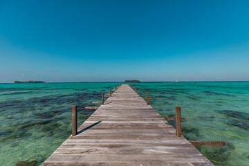 Amazing turquoise lagoon with jetty on Karimunjava tropical island, Indonesia