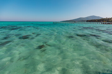 Amazing turquoise lagoon with jetty on Karimunjava tropical island, Indonesia