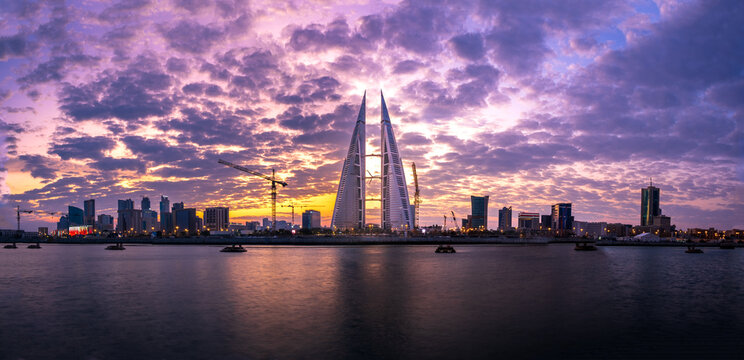 city skyline at sunrise with beautiful clouds in background