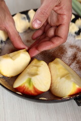 Arrange apple wedges into pan, skin side down. Making Apple Tarte Tatin with Cinnamon Series.