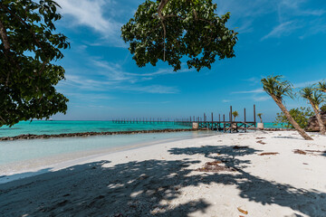 Amazing turquoise lagoon with jetty on Karimunjava tropical island, Indonesia