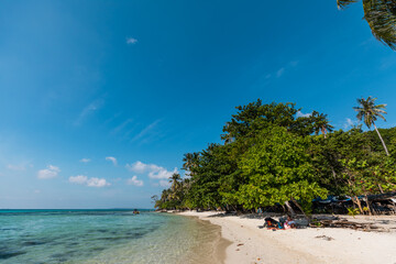 Tropical landscape of Indonesian island Karimunjava with jungle and turquoise lagoon in the distance. 