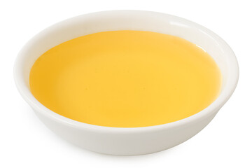 Agave syrup in a white ceramic bowl isolated on white.