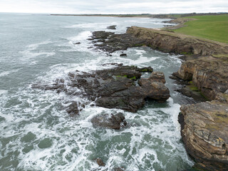 Fototapeta na wymiar Coastal Drone landscape with rough sea