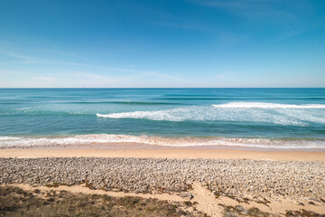Atlantic Ocean, with its waves, has washed up on the Portuguese coast a multitude of pebbles on the sandy beach, creating a beautiful setting for a day out. Fisherman Trail