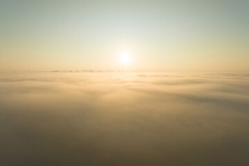 Fototapeta na wymiar Aerial view Beautiful foggy morning sunrise over cloud foggy