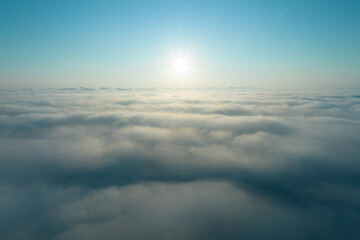 Aerial view at sunrise time over cloud foggy