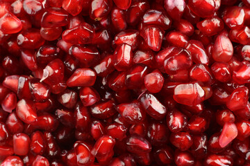 red pomegranate seeds close-up photo top view. Selective focus