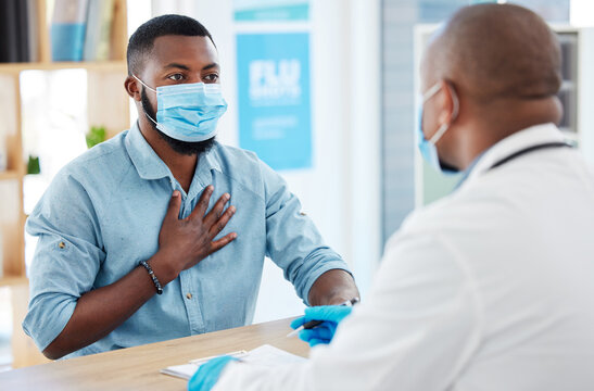 Doctor, chest pain and patient with covid in hospital for symptoms, examination and consultation. Healthcare, sick black man and medical professional with face mask for treatment or checkup in clinic