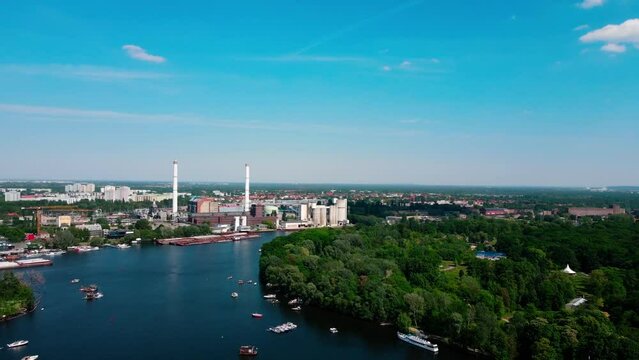 Aerial drone view of boats in the Spree River near Spreepark Planterwald and Treptower Park Berlin