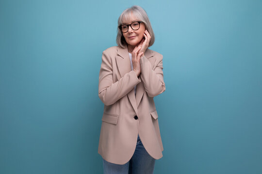 Preppy Fresh 60s Middle Aged Business Woman In Stylish Look On Bright Studio Background With Copy Space