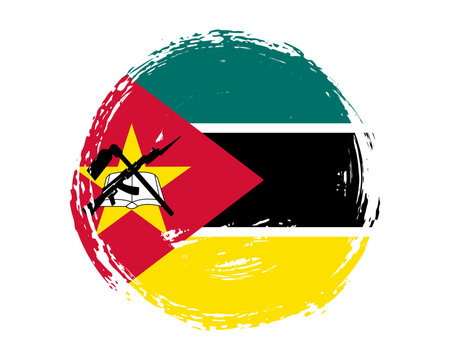 Circular hand painted textured brush flag of Mozambique country with plain solid background