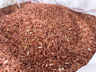 brown rice on a wooden background