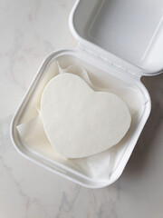 Small white bento cake heart as a gift for the holiday. mock up for design