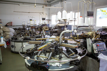 production of capron tights. Textile factory with machines and equipment for production of women's stockings and capron tights.