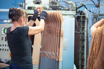 production of capron tights. Textile factory with machines and equipment for production of women's stockings and capron tights.