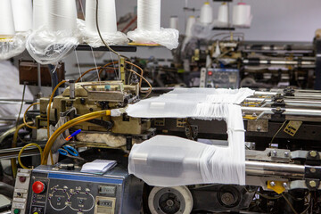 production of capron tights. Textile factory with machines and equipment for production of women's stockings and capron tights.