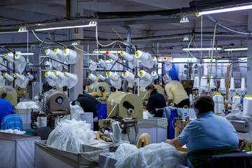 production of capron tights. Textile factory with machines and equipment for production of women's stockings and capron tights.