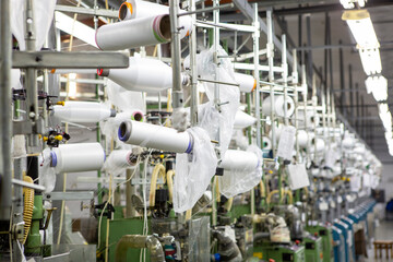 production of capron tights. Textile factory with machines and equipment for production of women's stockings and capron tights.