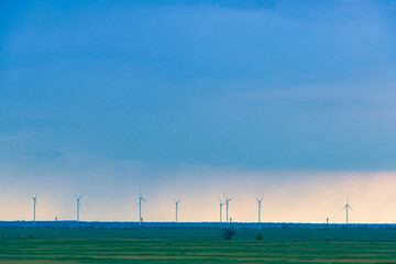Wind turbines under the rainy sky
