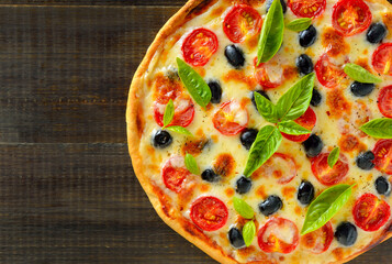 Homemade pizza with tomato and olives