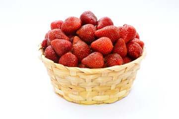 strawberries in a basket on  white background