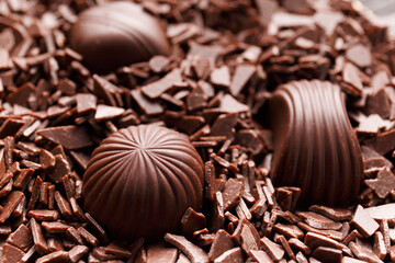 Candies in chocolate chips close-up macro photography.