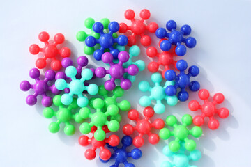 Children's puzzle, connecting parts for logical thinking. Bright geometric shapes for young children. View from above.