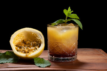 a glass of passion fruit cocktail and red wine, a reinterpretation of the Sex on the Baech cocktail