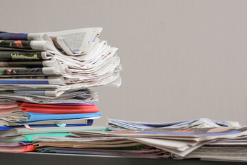 Pile of old newspapers, selective focus. Copy space