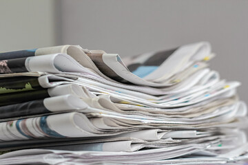 Pile of old newspapers, selective focus. Copy space