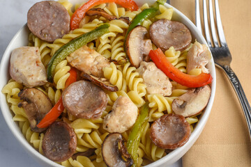 rotini pasta  with  sausage chicken and peppers