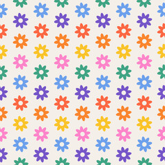 Vector seamless pattern features a playful and colorful floral print. The abstract geometric pattern is in vibrant rainbow colors, including shades of purple, pink, orange, green, blue, and yellow. 