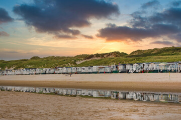 Beach houses on the beach of Egmond aan Zee/NL in the evening