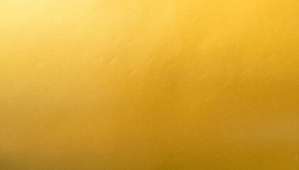 Gold wall texture background. Yellow shiny gold foil paint on wall surface with light reflection,...