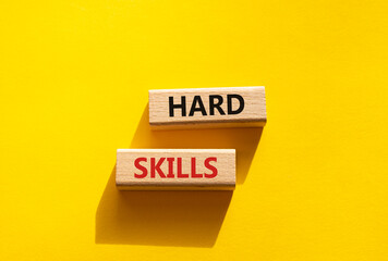 Hard skills symbol. Wooden blocks with words Hard skills. Beautiful yellow background. Business and Hard skills concept. Copy space.