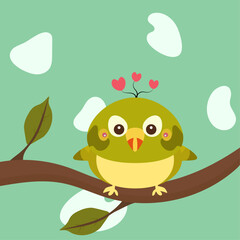 green bird with a heart on its head sits on a branch with green leaves