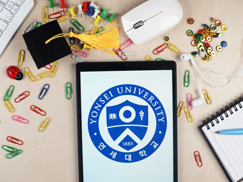 In this photo illustration,  Yonsei University  logo seen displayed on a tablet.