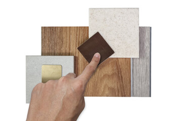 designer's hand choosing interior design material samples for architecture decoration consists...