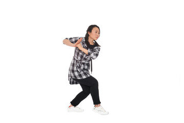 Asian young woman doing martial arts in everyday casual street clothing
