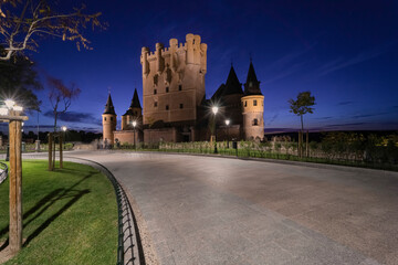 Walkway leading to the Castle and Alcazar of Segovia illuminated at dusk. Segovia. Castilla y Leon. Spain
