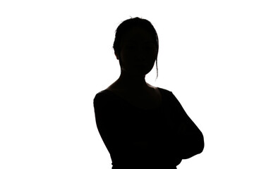 Black backlit silhouette of head and shoulders of an oriental woman from front view outlined by...
