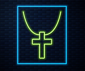 Glowing neon line Christian cross on chain icon isolated on brick wall background. Church cross. Vector