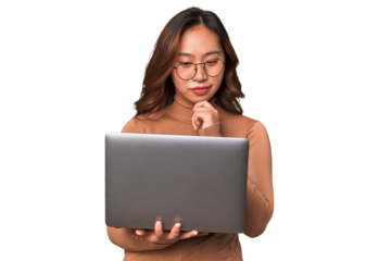 A young asian woman working with her laptop thinking about an idea