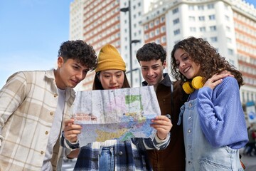 Adventurous friends exploring new city with map