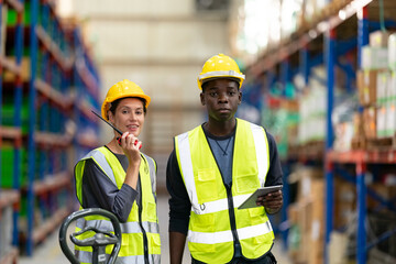 Warehouse workers checking the inventory. Products on inventory shelves storage. .Worker Doing Inventory in Warehouse. Dispatcher in uniform making inventory in storehouse. supply chain concept - obrazy, fototapety, plakaty